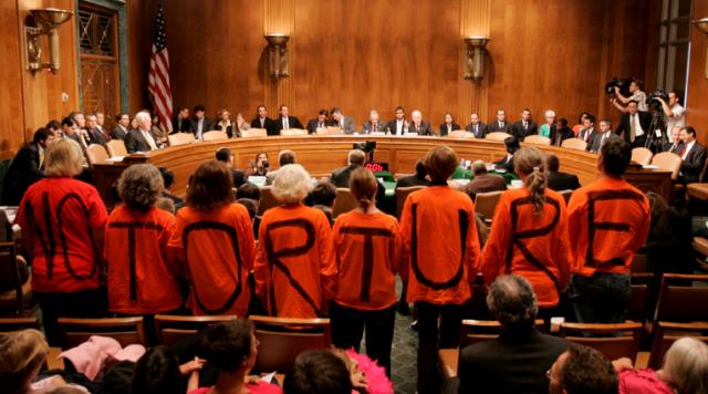 Silent protest during a Senate hearing on Guantanamo Bay.
