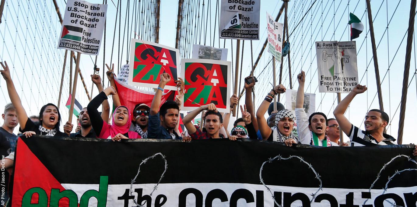 Demonstrators march across the Brooklyn Bridge during a pro-Palestinian rally