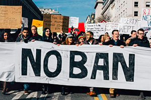 Protesters marching against the Muslim ban