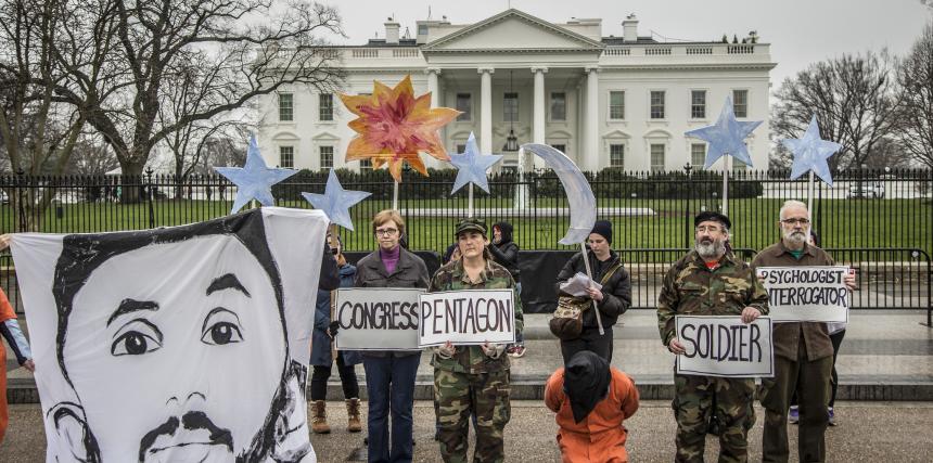 Witness Against Torture protesters in front of White House with image of CCR client Mohammed Al-Hamiri 