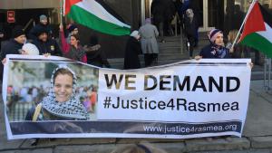Rally with banner reading "We Demand Justice for Rasmea"