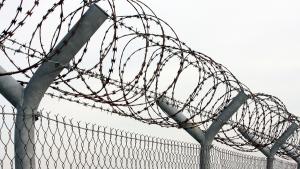 barbed wire on a prison fence