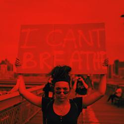 protester holding sign reading "I Can't Breathe"