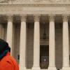 hooded Guantanamo protester in front of Supreme Court